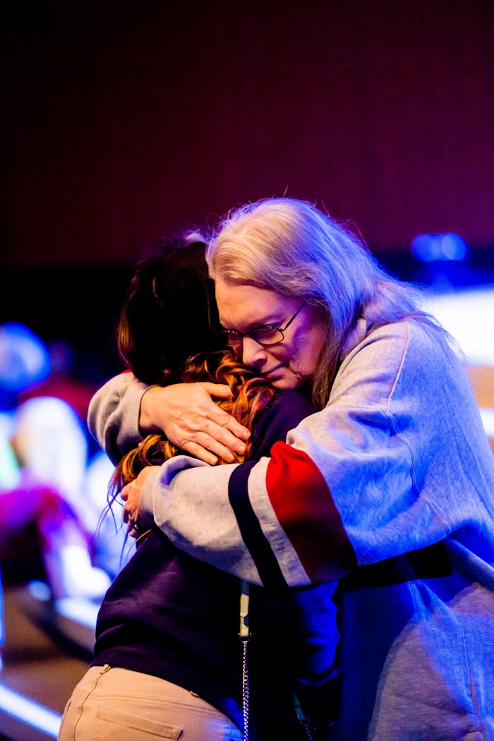 heartfelt-hug-between-two-adults-in-emotional-setting-34611362